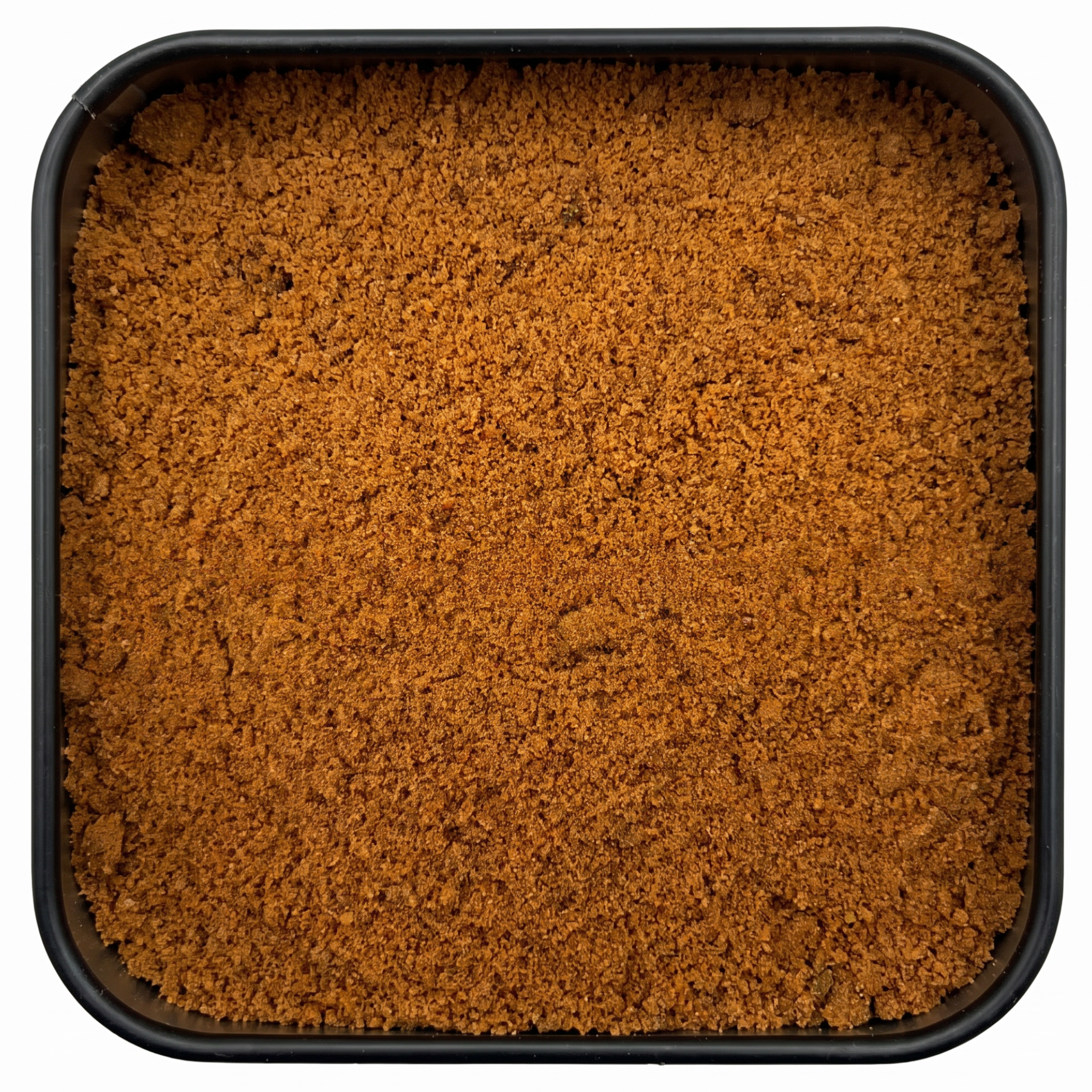 Macis gemahlen, feines orange-braunes körniges Pulver, in schwarzer Gewürzdose, warm-feinwürzig.