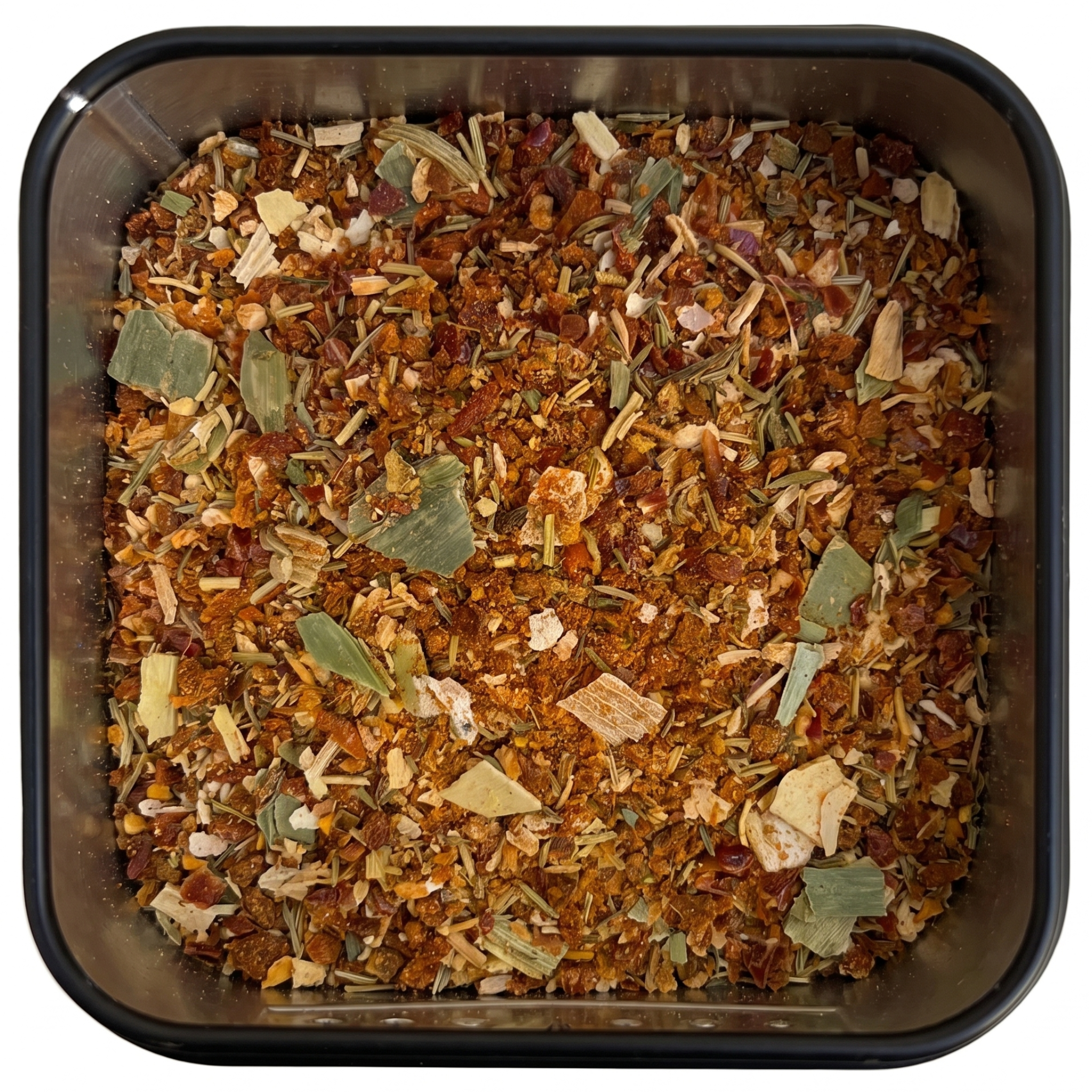 Chimichurri-Gewürzmischung, orange-braun mit grünen Salbeiblättern, in schwarzer Gewürzdose.
