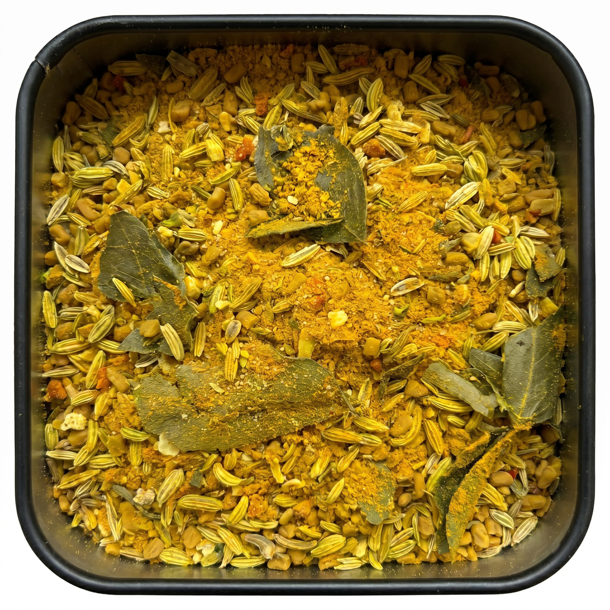 Gemüse Masala mit Fenchelsaat, Curryblättern und Bockshornklee, gelb-grün, in schwarzer Gewürzdose