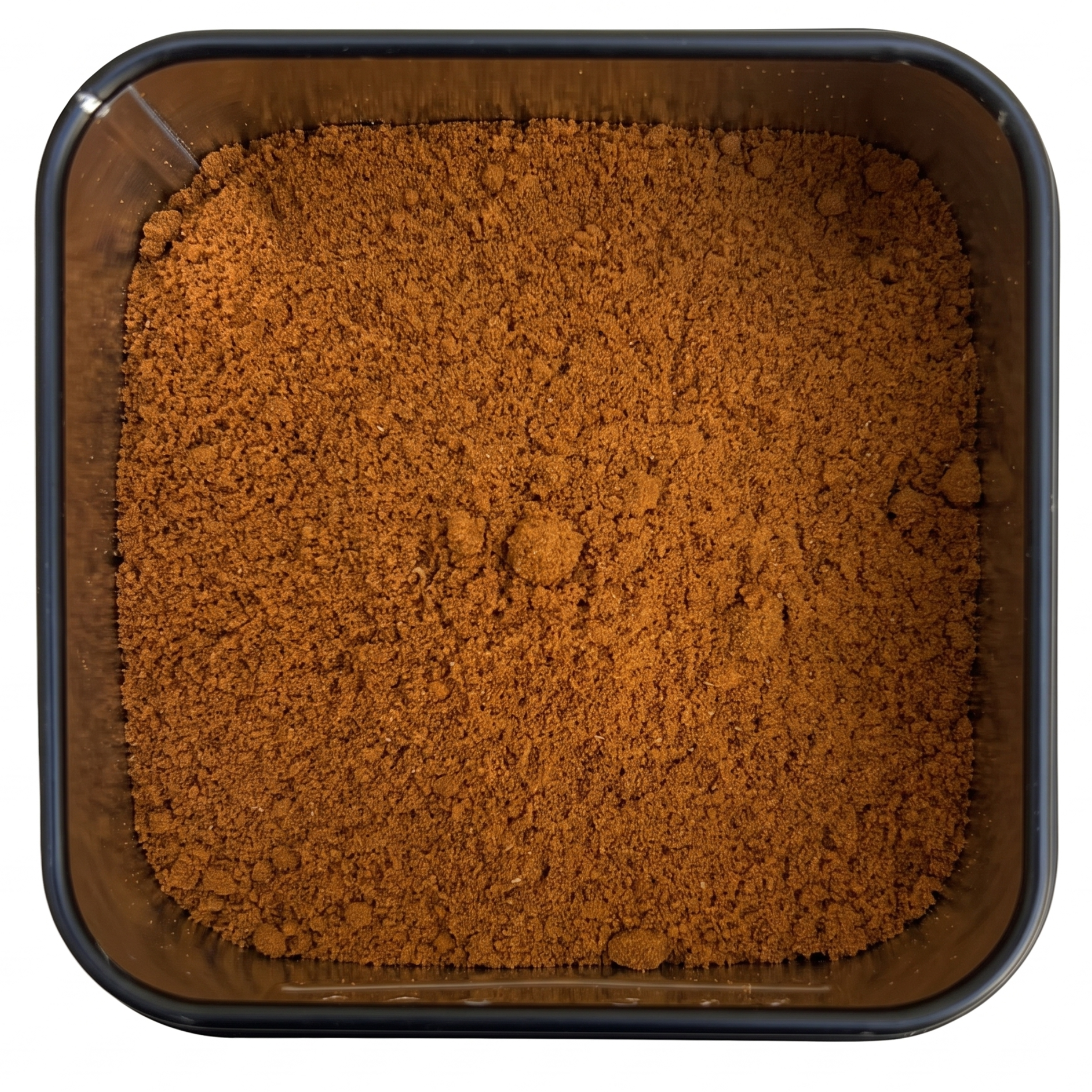 Ceylon Curry, kräftig orange-braunes Currypulver, in schwarzer Gewürzdose, würzig-authentisches Aroma