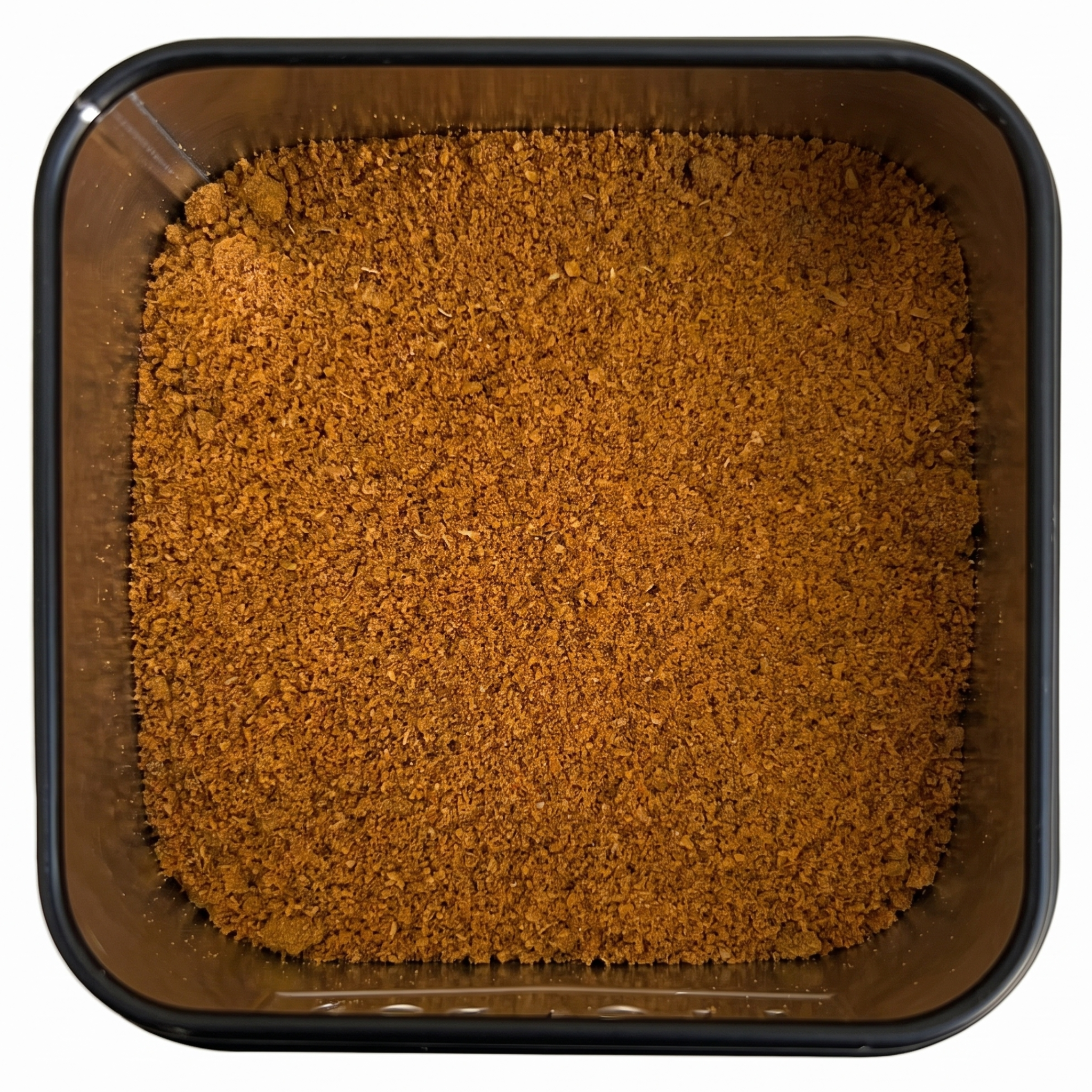 Ignis Curry, kräftig orange-braunes Currypulver, in schwarzer Gewürzdose, würzig-scharfe Fruchtnote