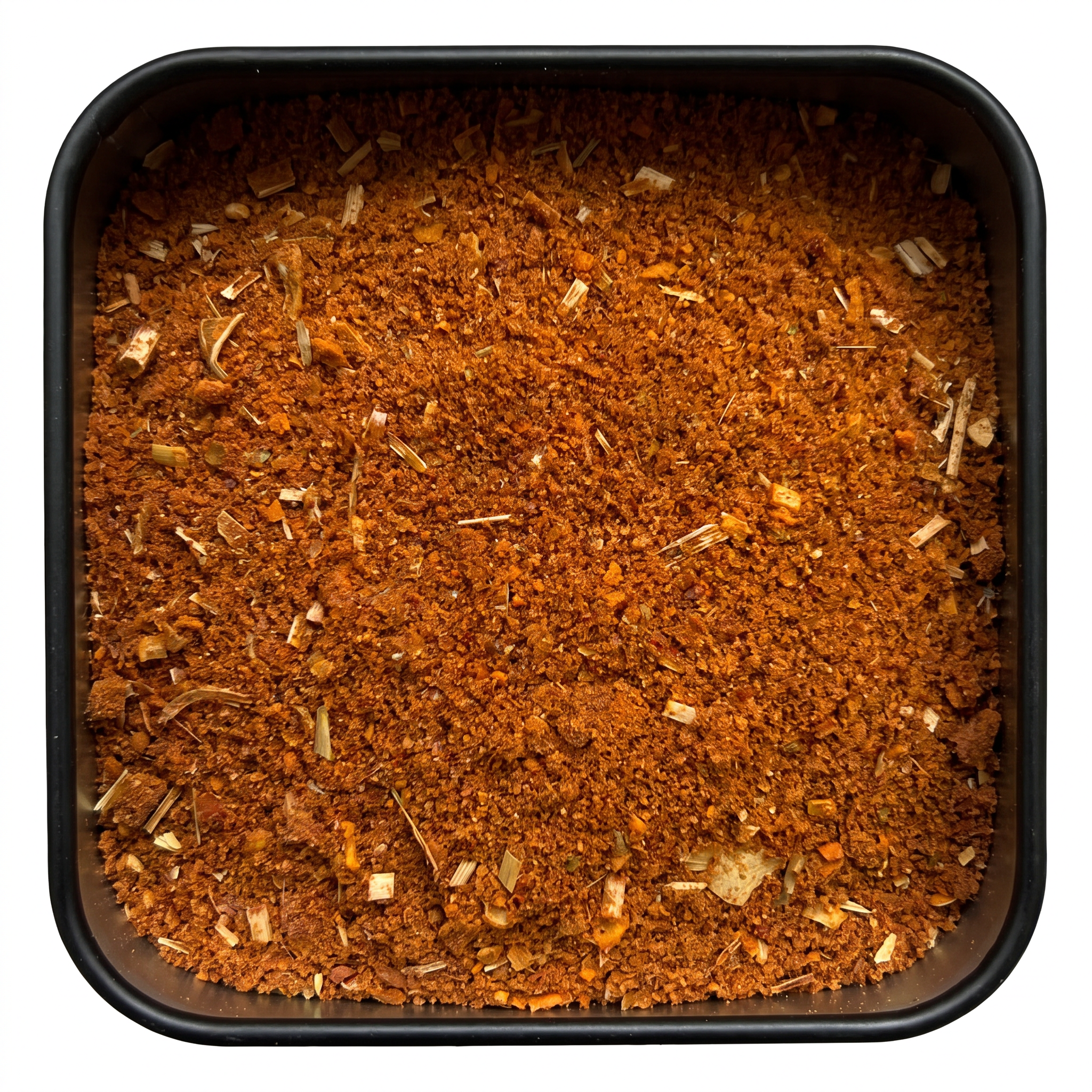 Rotes Thaicurry, kräftig orange-rotes Currypulver mit Zitronengras, in schwarzer Gewürzdose