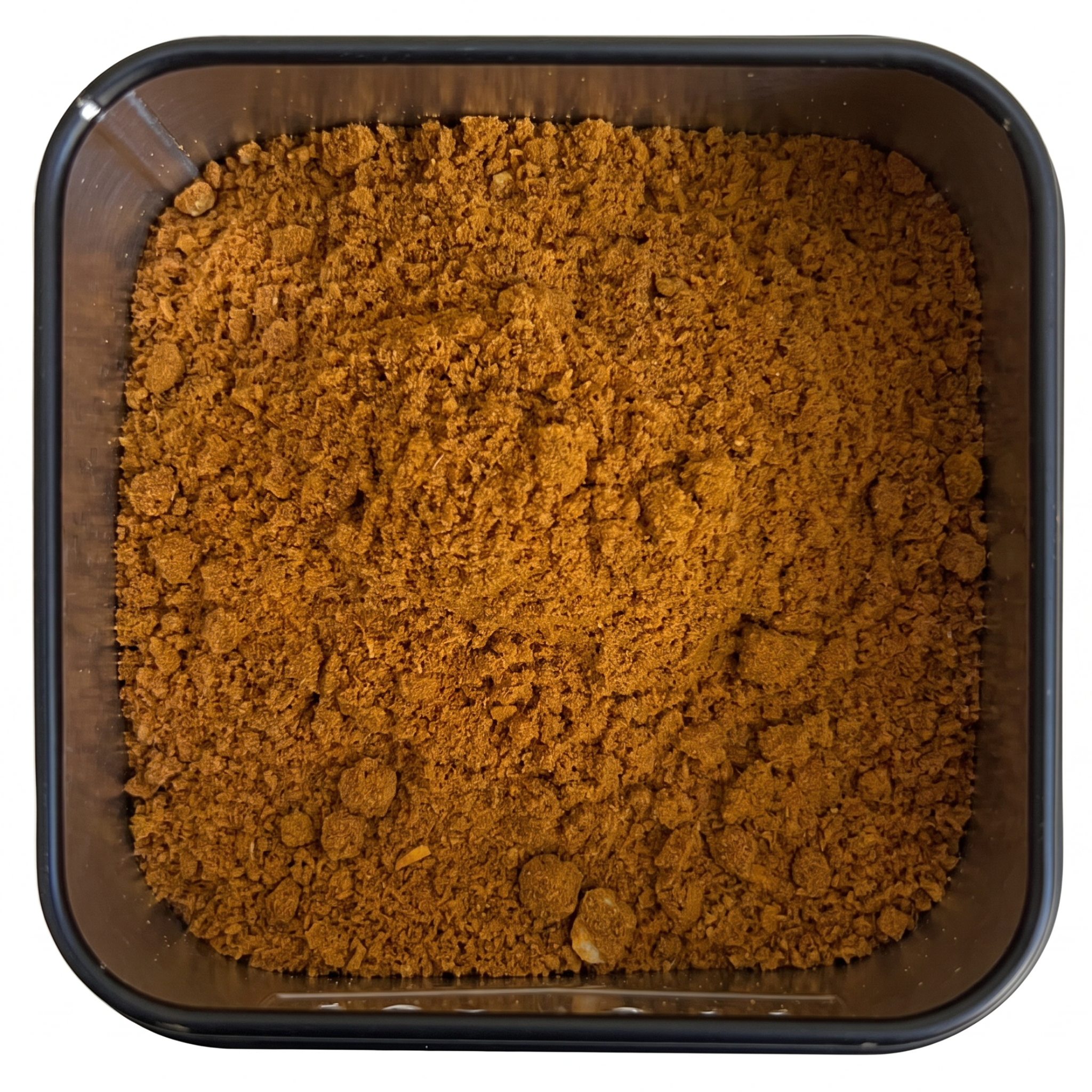 Zitronencurry, kräftig orange-braunes Currypulver, in schwarzer Gewürzdose, frisch-zitroniges Aroma.